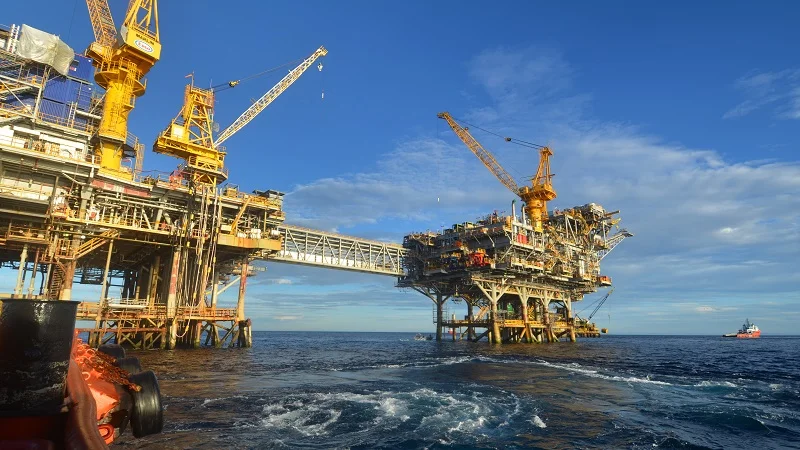 Offshore oil and gas platforms view from a boat.