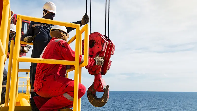 offshore_rig_workers_crane_hook