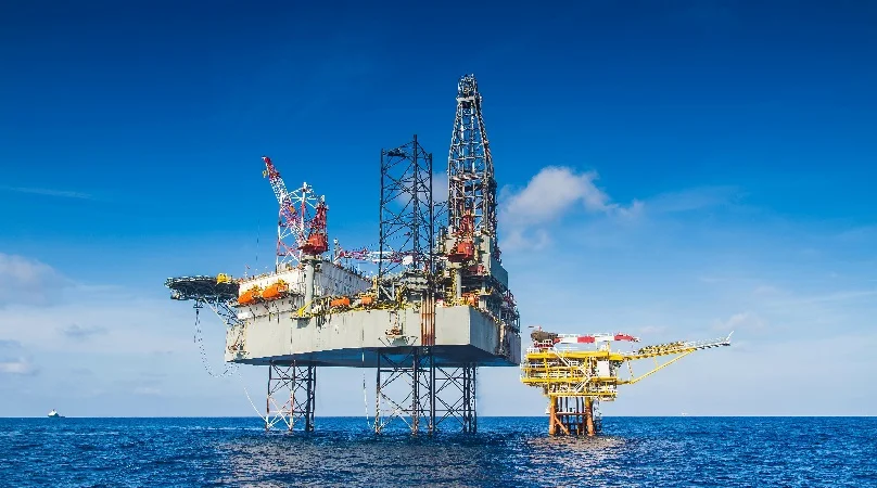 Offshore oil rig against blue sky