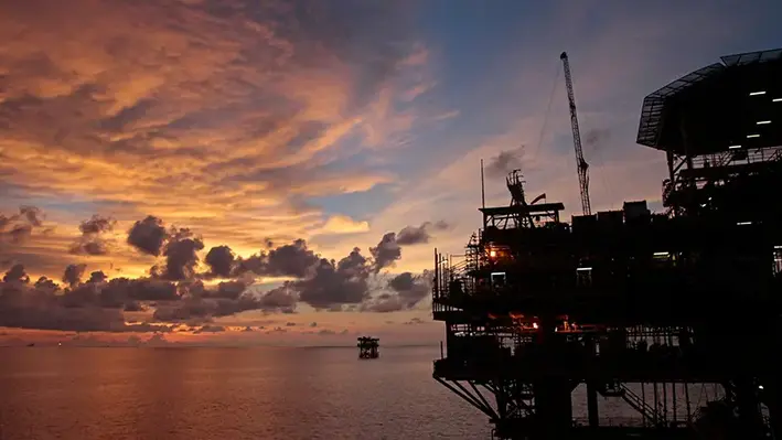 offshore oil rig sunset Southeast Asia
