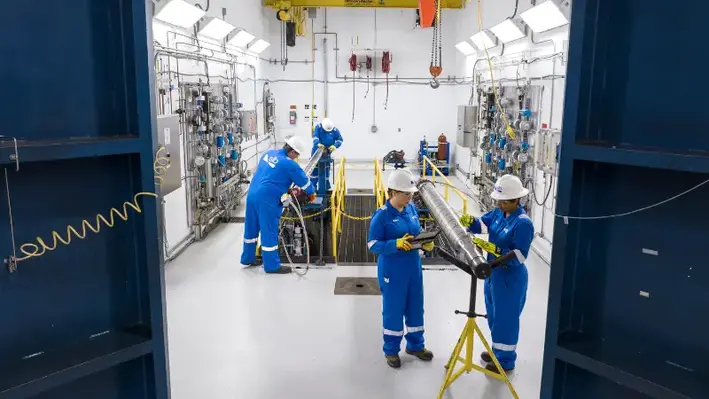 SLB engineers in a workshop