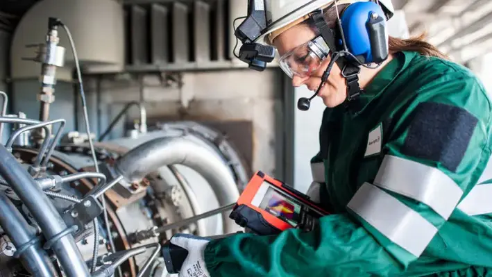 Baker Hughes employee on a tablet