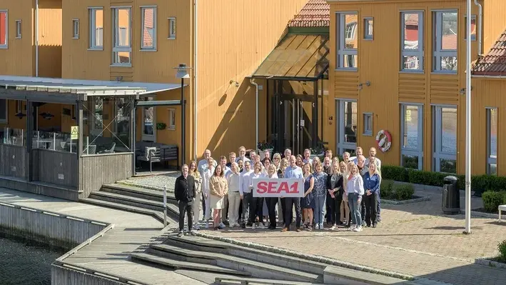Employees at the Sea1 head office in Kristiansand stand behind the new company name. (Image source: Sea1 Offshore) 